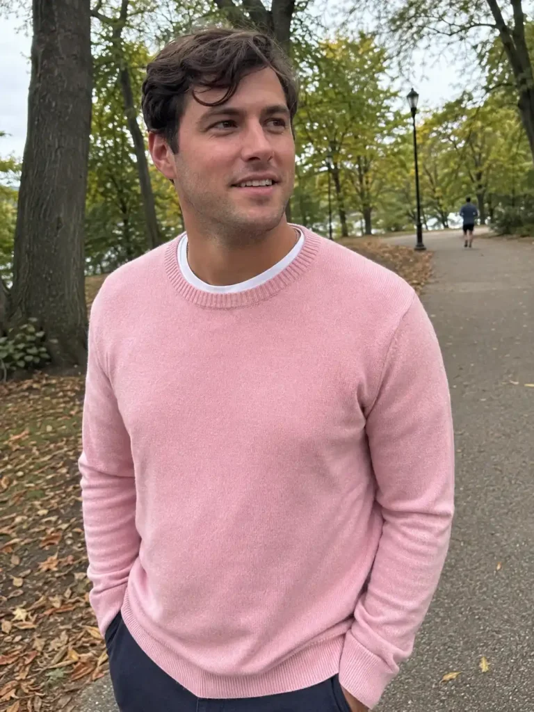 3. Pastel pink crewneck sweater over a white tee