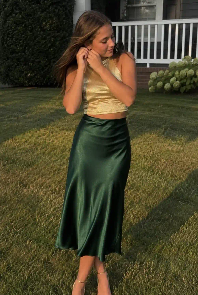 Gold crop top with an emerald
