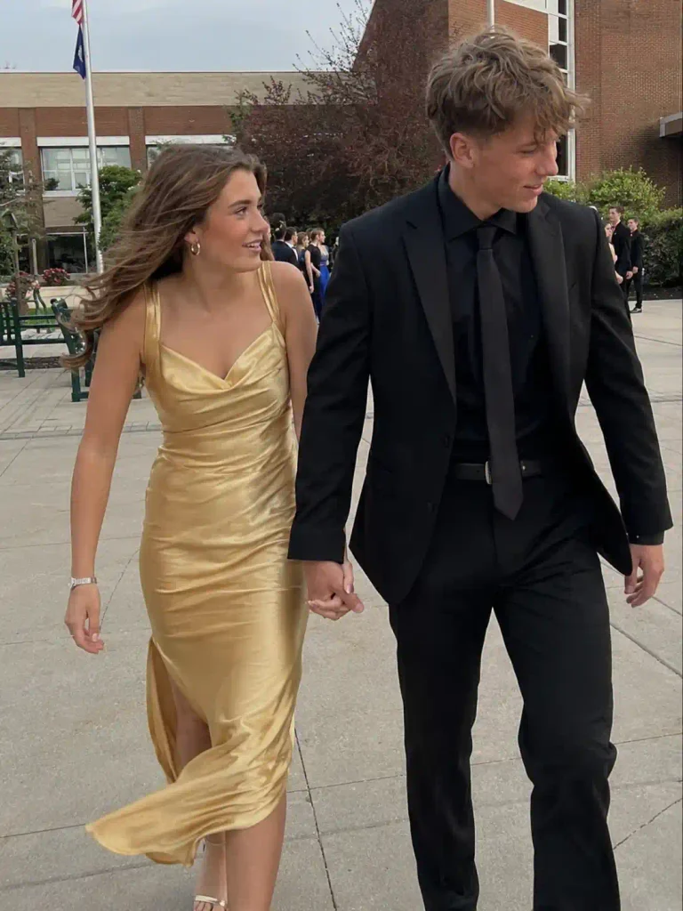 Gold dress with a deep emerald suit