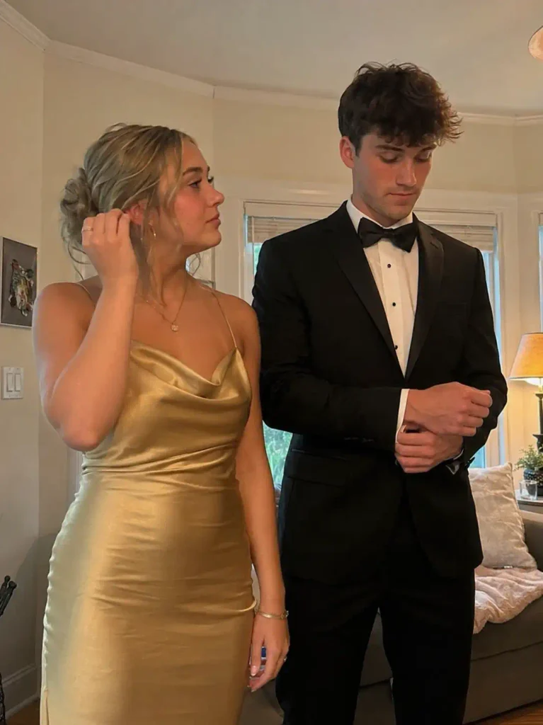 Gold satin slip dress with a black bow tie