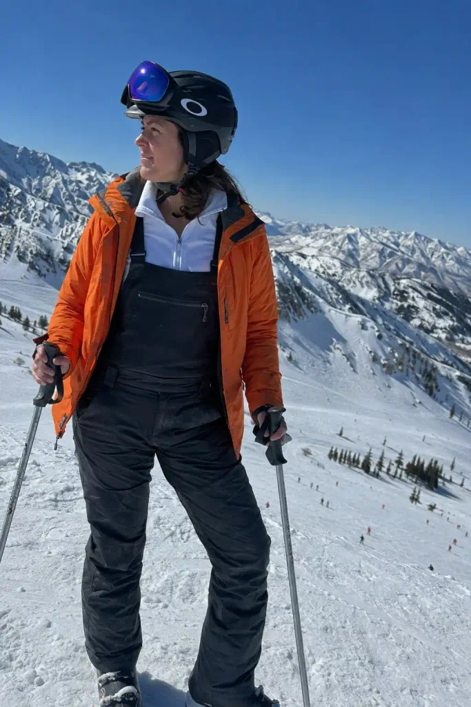 Orange jacket, black bibs