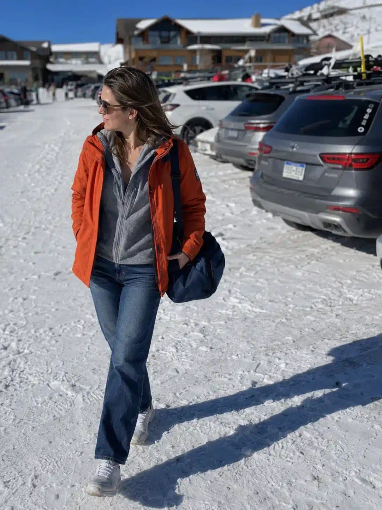 Orange jacket, straight-leg jeans