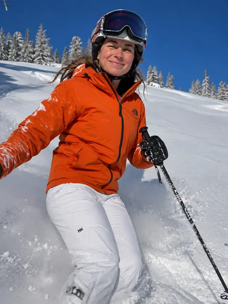 Orange jacket, white pants