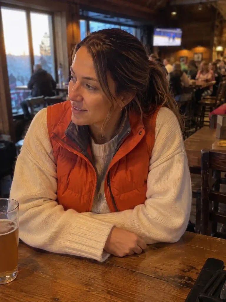 Orange vest layered over a ch