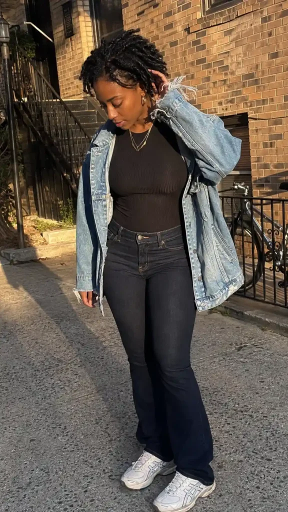 Oversized denim jacket over a bodysuit