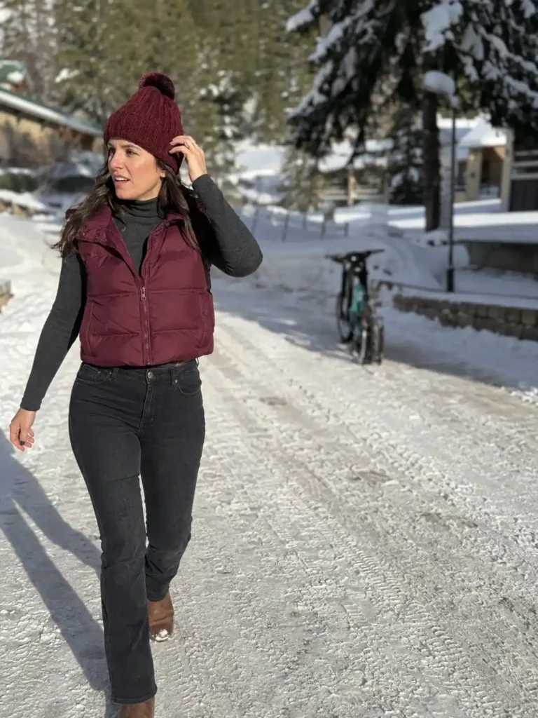 Puffer vest over a fitted turtleneck