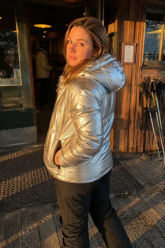 Silver puffer jacket with black snow pants