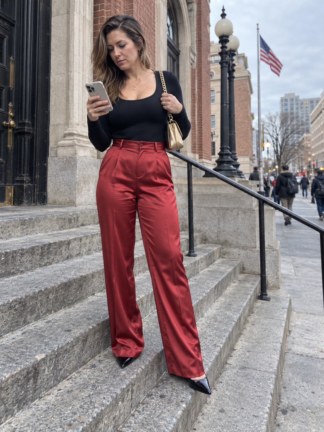 Red satin trousers with a black bodysuit